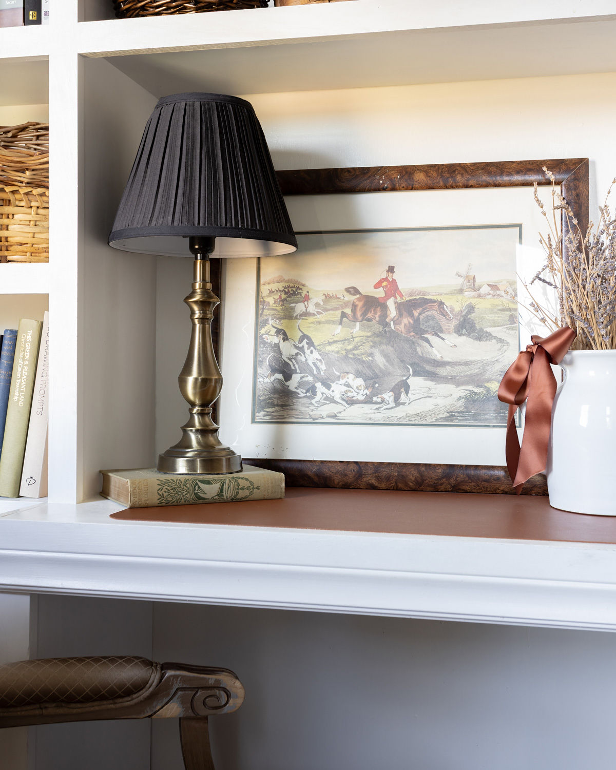 Vintage English hunt painting on a small desk nook.