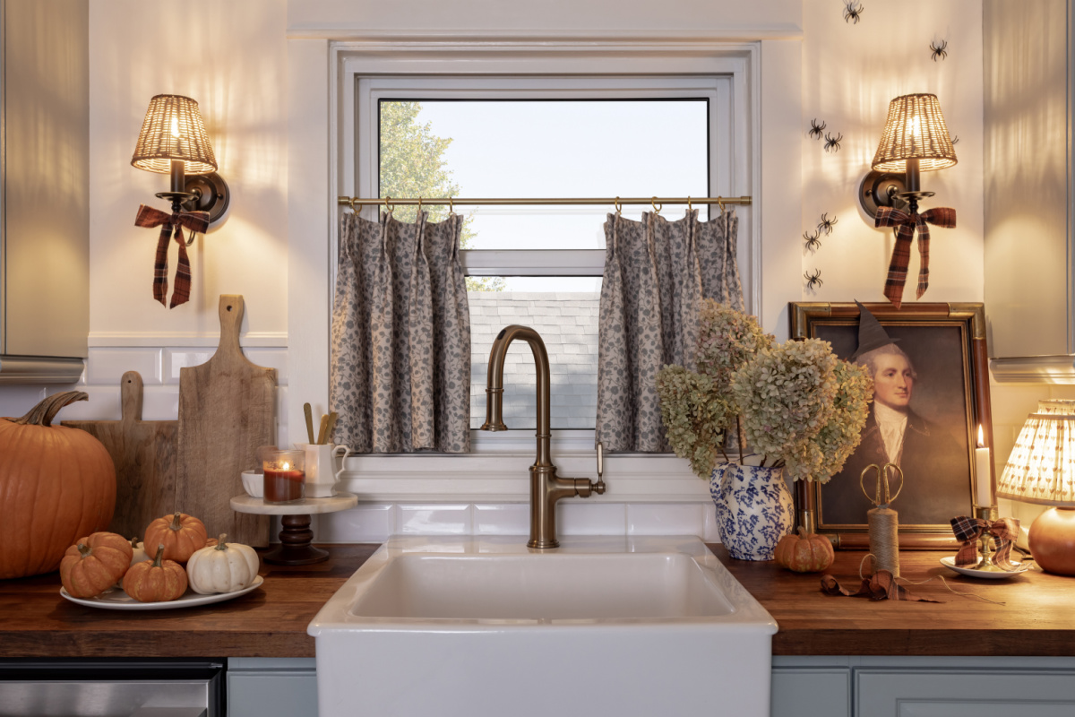 A kitchen counter area decorated with vintage style Halloween decor.