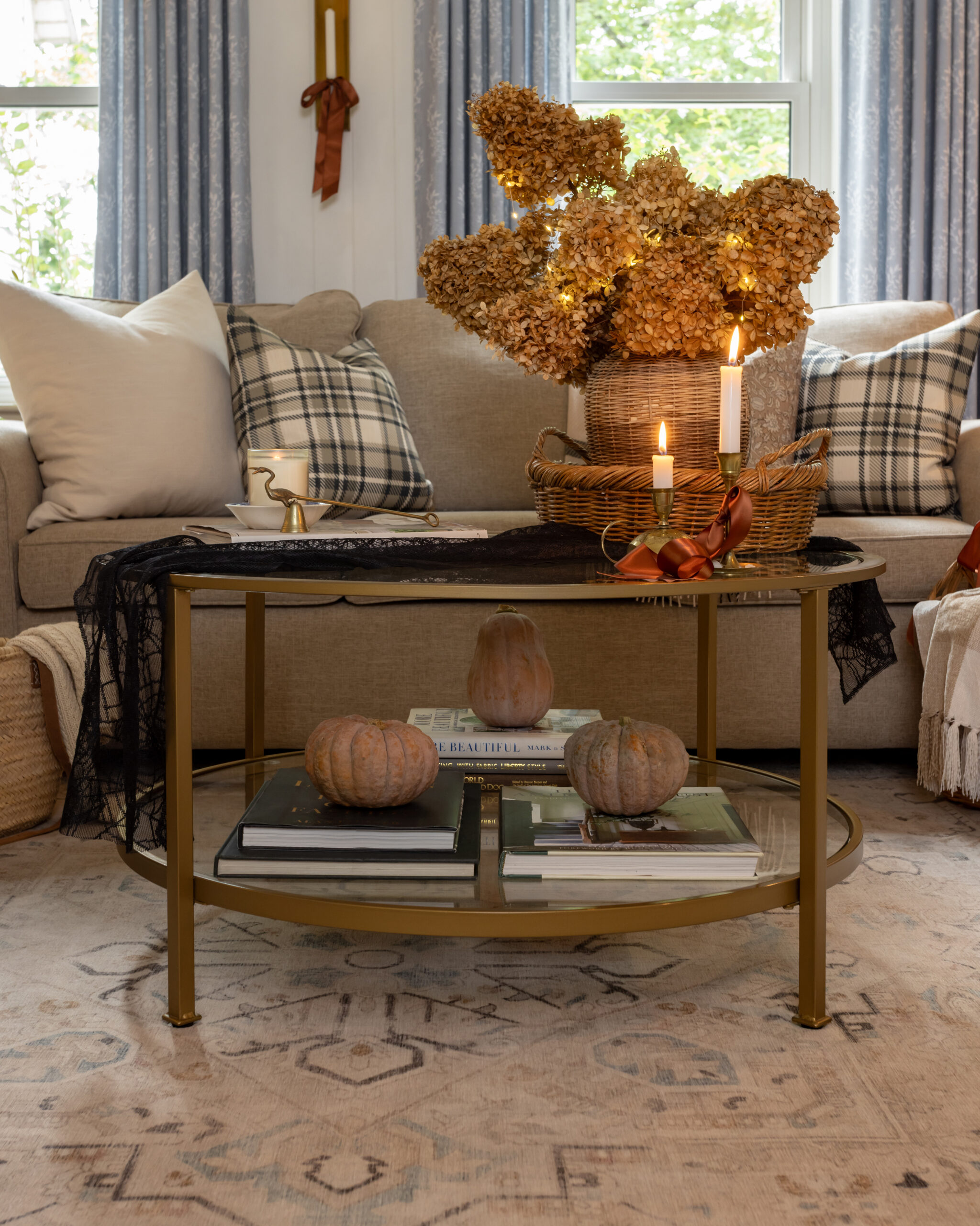 Twinkle lights with dried hydrangeas on a coffee table.