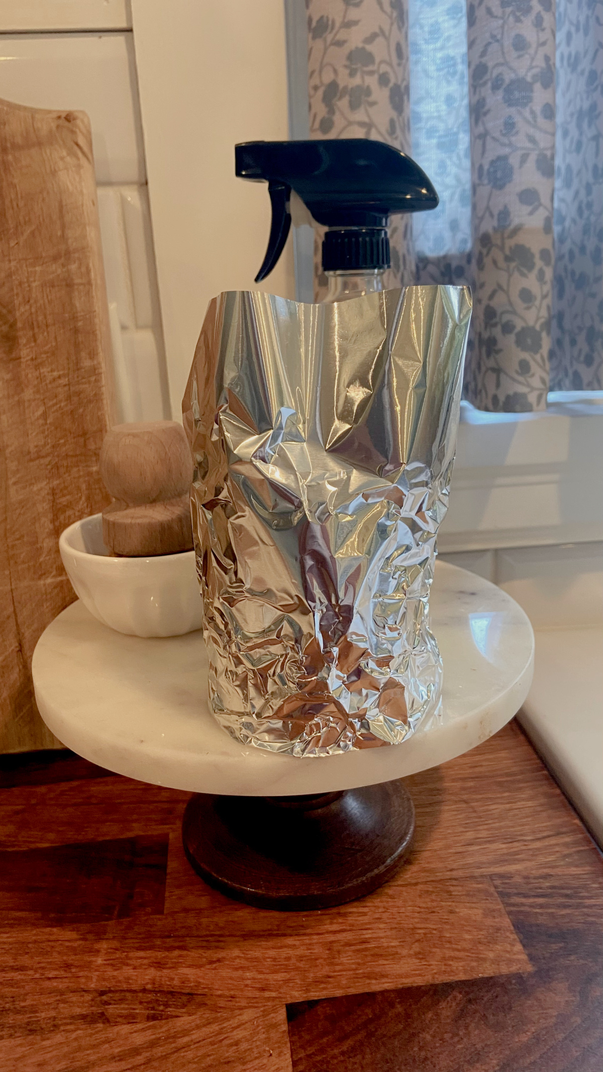 Candle wrapped in aluminum foil.